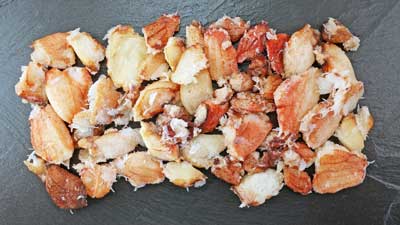 A photograph of plump and juicy chilean crab claw meat.